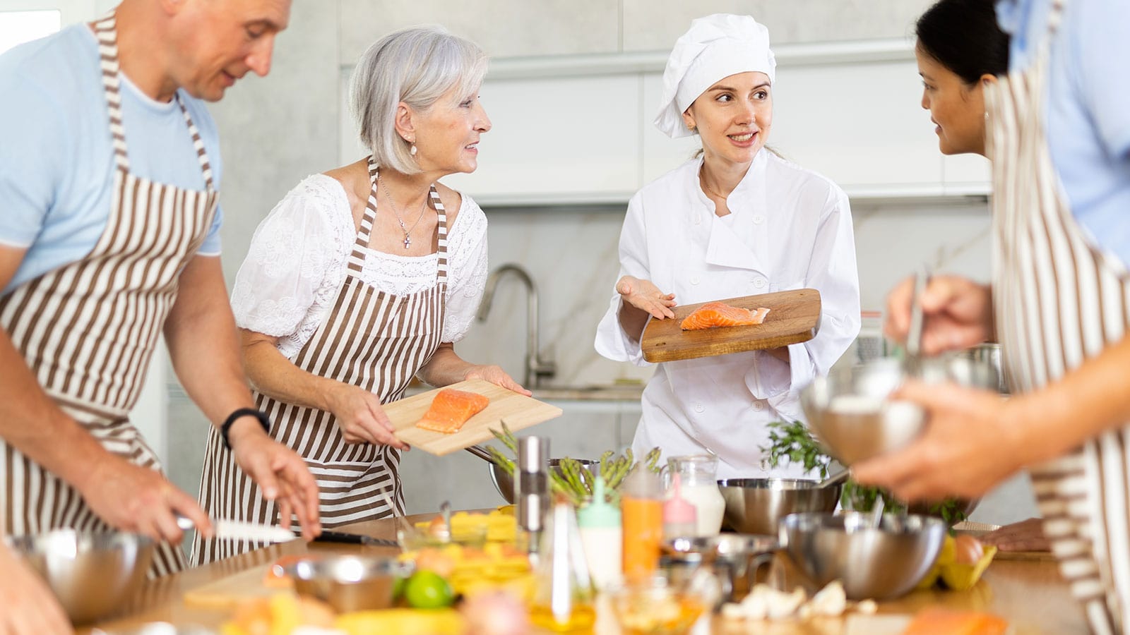 Smiling Waiter Smiling waiter holding tray with burger and fries