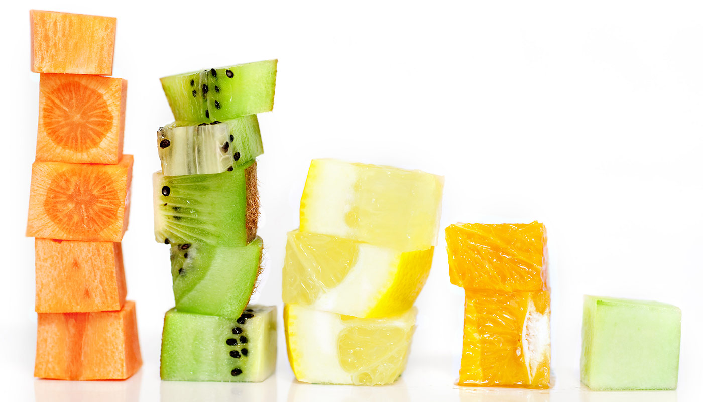 Fruit Stacks Stacks of fruit including oranges, kiwi and pineapple